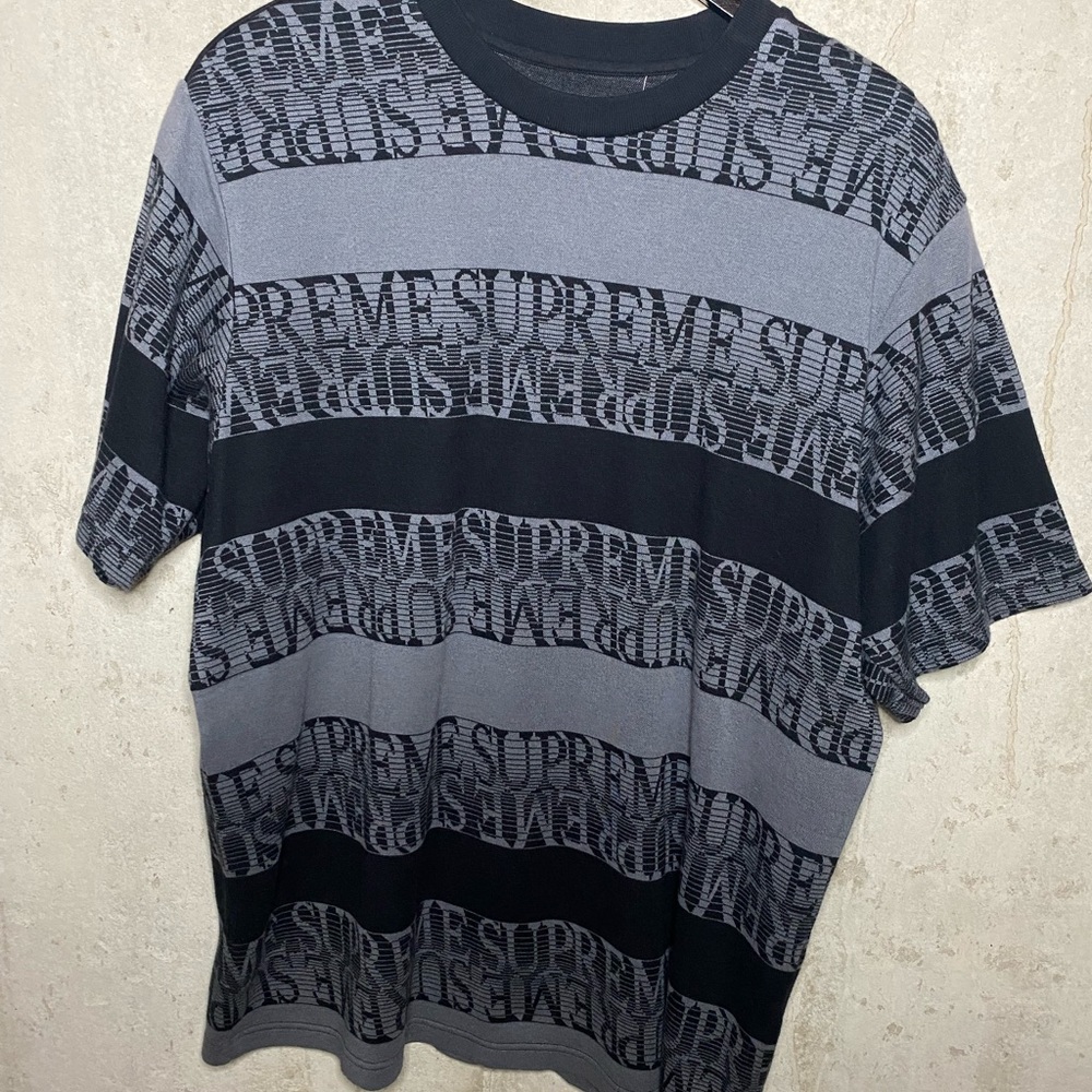 Grey and Black Supreme t shirt.